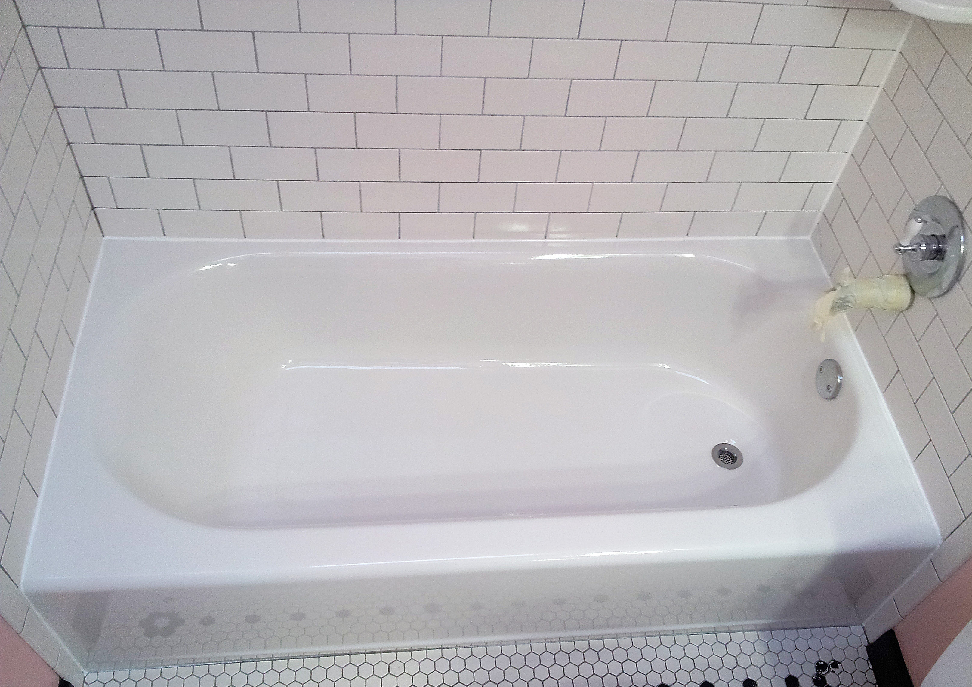 white porcelain bathtub after cleaning service
